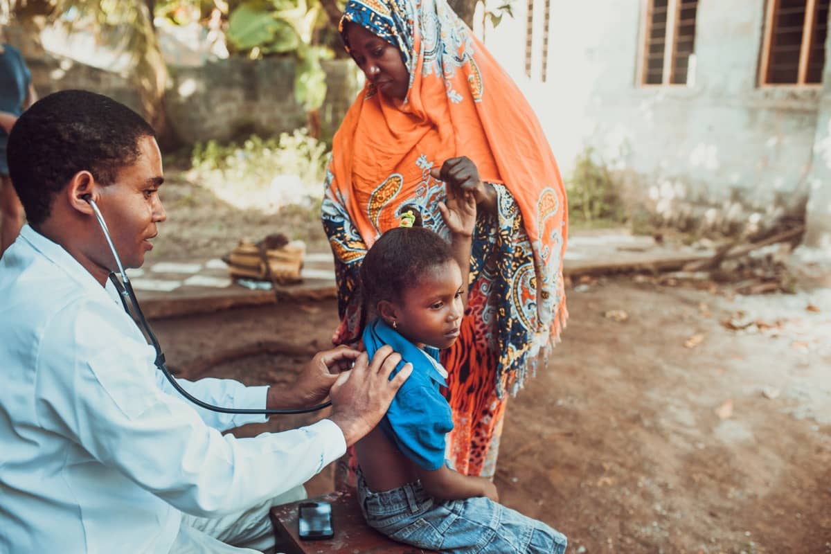 Doctor with a young patient in Africa