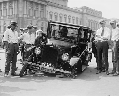 vintage car broken down with detached wheel 