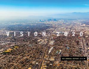 Vision 2020 HEI Annual Report 2015, text display over a sprawling city scape with blue skies and mountain in the far distance.
